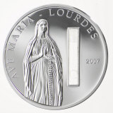 Embedded water from Lourdes in a commemorative coin from Palau