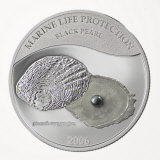 An embedded pearl on a commemorative coin from Palau