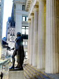 A bronze George Washington statue on the steps of Federal Hall