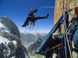 A climber rappels down to his hanging tent 2 000 feet above the ground