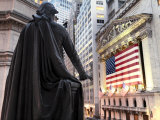 A bronze statue of George Washington and the New York Stock Exchange