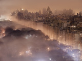 Light pollution and fog combine to blur a New York City skyline