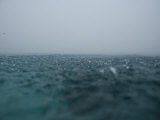 Traveling by boat to the ancient city of Nan Madol in a downpour