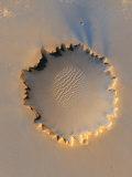 A color-enhanced satellite view highlights details of Victoria Crater