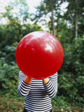Close-up of a Woman Blowing a Balloon  Germany