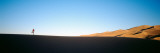 Low Angle View of a Woman Running in the Desert  Great Sand Dunes National Monument  Colorado  USA