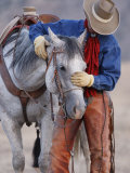 Cowboy Leading and Stroking His Horse  Flitner Ranch  Shell  Wyoming  USA