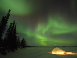 Igloo Lit Up at Night under Northern Lights Northwest Territories  Canada March 2007