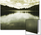 Water Reflecting Bordering Trees and Sky