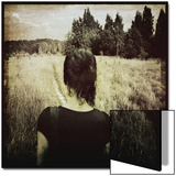 Woman Following Trail in Field