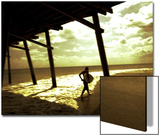 Surfer Walking along Tide