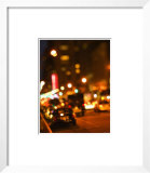 Blurred View of Cars and Illuminating Lights and Signs on Busy City Street at Night