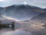 Reflective Water Landscape in Front of Snowcapped Mountain