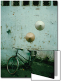 Conical Hats Hang on Wall Above Bicycle in Historic Old Quarter  Hanoi  Vietnam
