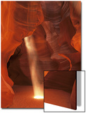 Sunbeam Illuminates Sandy Floor and Sandstone Walls of a Slot Canyon  Antelope Canyon  Page