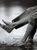 Couple Splashing Water withFeet