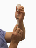 Male Nurse Drawing Intravenous Injection