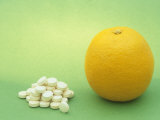 Vitamin C Tablets and an Orange  a Natural Source of This and Other Nutrients