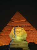 Sphinx and One of the Pyramids Illuminated at Night  Giza  Cairo  Egypt