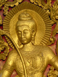 Figure Carved in Relif and Gilded on the Wood Doors of the Wat Xieng Thong at Luang Prabang in Laos