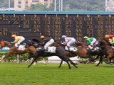 Horses Race Past Large Scoreboard During Race at Happy Valley Racecourse  Hong Kong  China