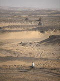 Man on Mule-Back Traverses the Desert around the Ancient City of Old Dongola  Sudan  Africa