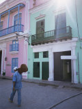 Man with Guitar Walking Past Coloured Buildings in Central Havana  Cuba  West Indies