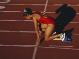 Female Runner at the Start of a Track Race