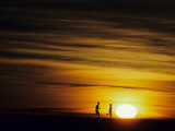 Couple Running at Sunset