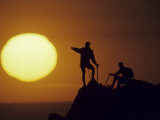 Two Mountain Climbers at Sunset