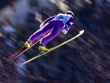 Blurred Action of Ski Jumper Flying Throught the Air