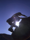 Woman Rock Climbing Without Equipment