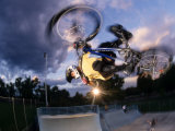 Bmx Cyclist Flys over the Vert