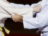 Detail of the Hands of Judo Competitors in Action