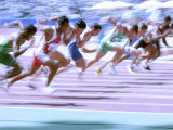 Blured Action at the Start of a Mens 100 Meter Track and Field Race