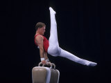 Male Gymnast Performing on the Pomell Horse