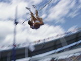 Pole Vaulter Flys over the Bar