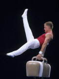 Male Gymnast Performing on the Pomell Horse