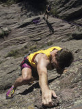 Man Rock Climbing While Tethered to Another Climber Below