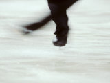 Detail of Male Figure Skater's Legs and Boots Spinning
