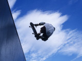 Skateboarder in Action over the Vert