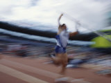 Pole Vaulter Flys over the Bar