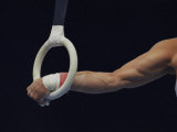 Detail of the Hands of Male Gymnast Grabing the Ring