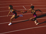 Female Runner Competing in a Relay Track Race