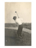 Boy Golfing in Field
