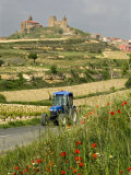 Blue tractor on rural road  San Vicente de la Sonsierra Village  La Rioja  Spain