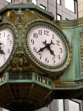 Ornate clock on building in downtown  Chicago  Illinois  USA