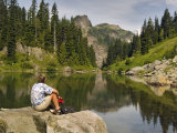Hiker at the shore of the Tatoosh Lake  Tatoosh Wilderness  Washington State  USA