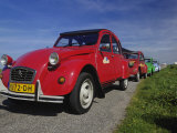 Small old cars along dike  Holland  Netherlands