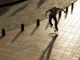 Skateboader Jumping on Tiled Sidwalk  Cuenca  Ecuador